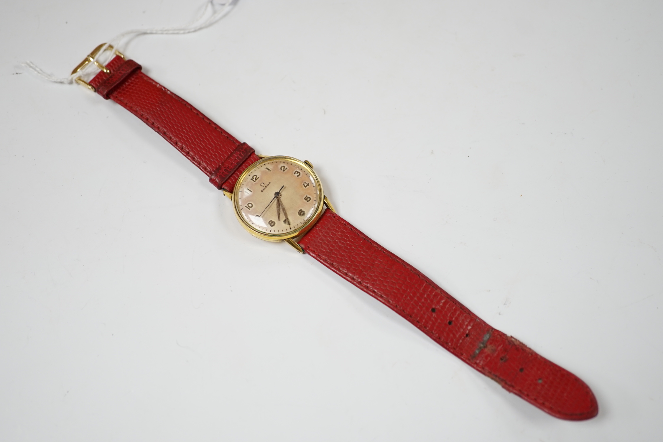 A gentleman's late 1940's gold plated Omega manual wind wrist watch, on associated leather strap, case diameter 32mm, no box or papers.